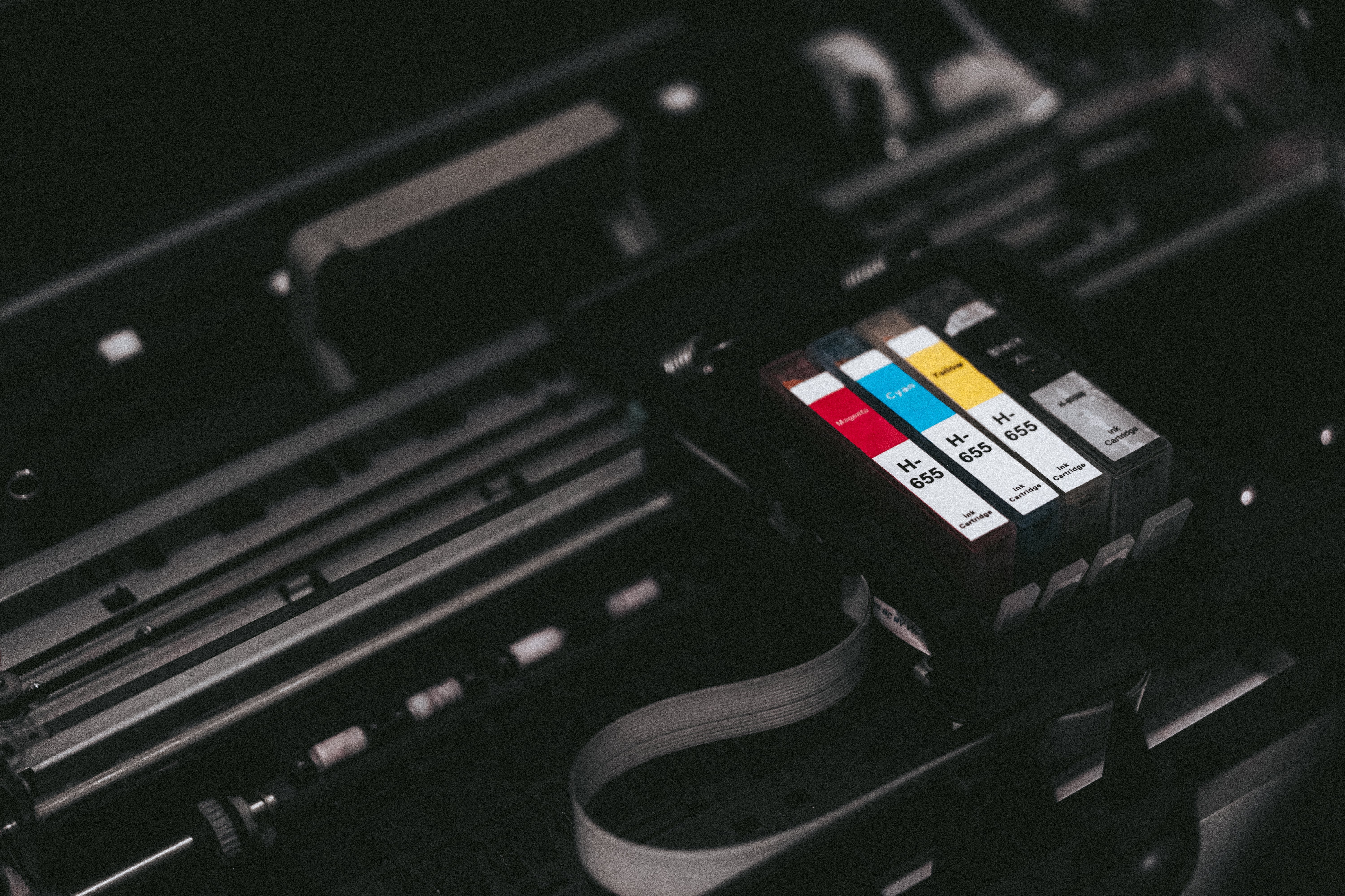 cmyk-ink-cartridges-in-a-printer-picjumbo-com-min