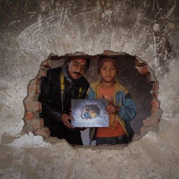 During the tour, we came across some of the characters in the books. Here, Amrit Gurung presents a copy of the book to Hemanta at the exact spot in Motipur or Kailali where he had taken the picture five years previously.