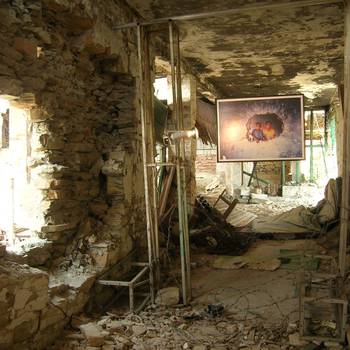 In many places, like this bombed-out hospital in Chautara in which two patients were killed during a night-long battle, the photographs were displayed amidst the ruins.