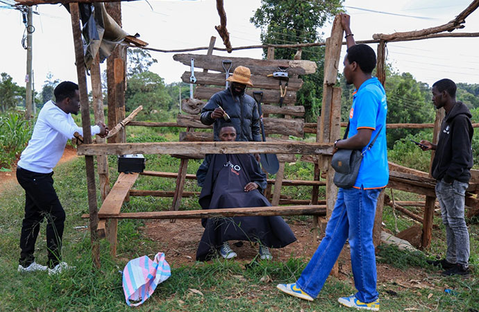 A Kenyan barber who wields a sharpened shovel thrives on Africa’s social media craze