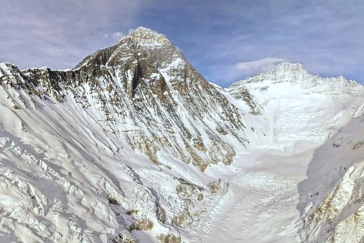 Photos show climbers attempting to scale Mount Everest despite increasing challenges