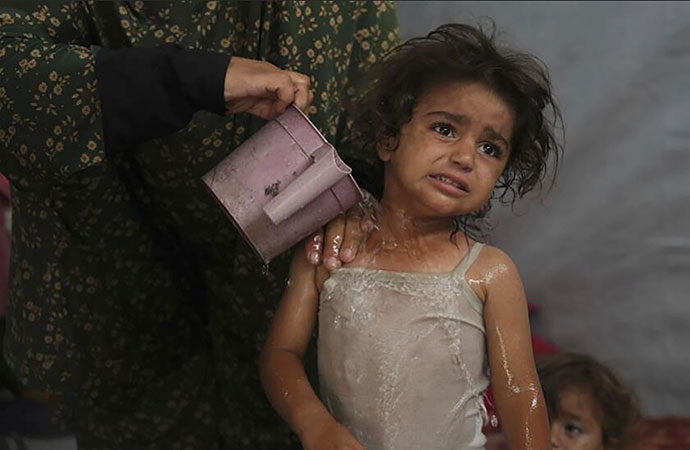 Palestinians walk long distances to fetch water and ration each drop. The heat is making it worse