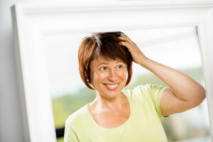 A woman is thinning across the whole head