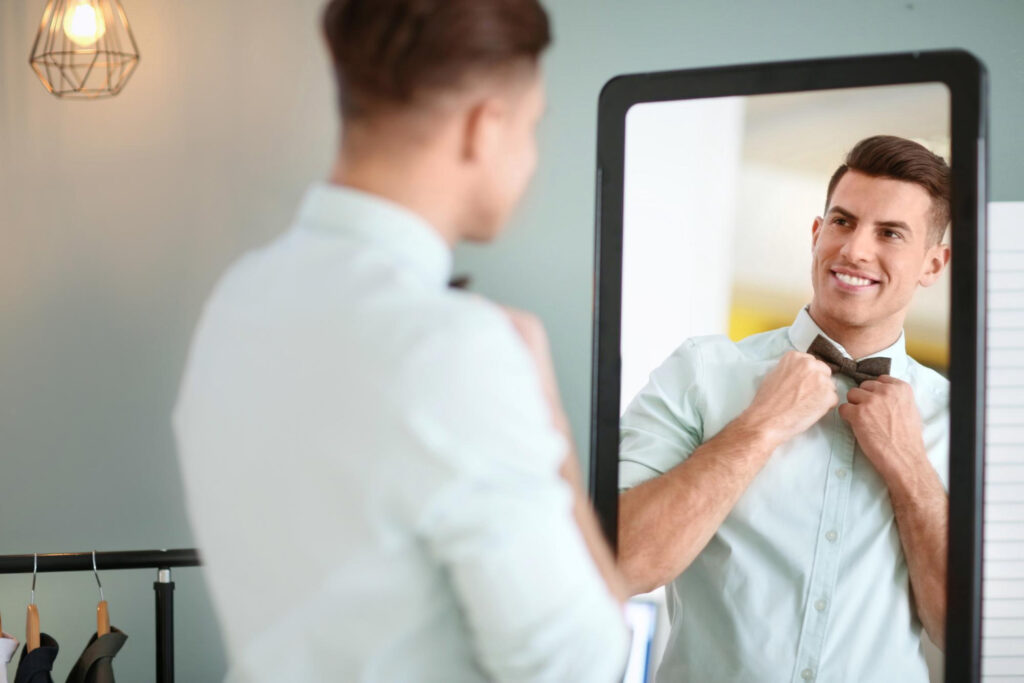 Man smiling with Grooming Products Every Man Needs