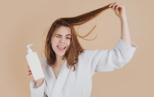 A girl with medium hair doing hair care