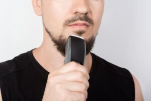 A man holding a trimmer