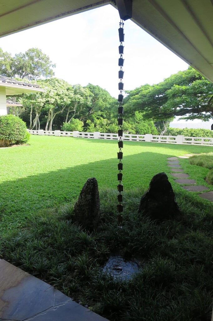 Rain chain in a house garden