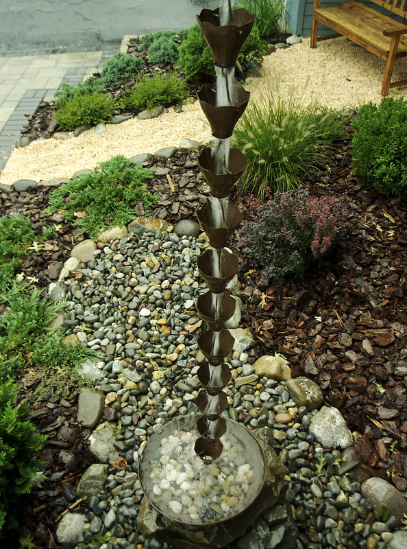 A rain chain at a backyard | Pic by chaim zvi on Flickr