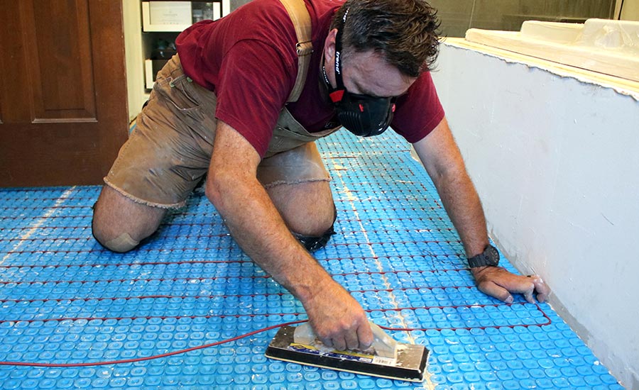 A Man Heats the Tiles