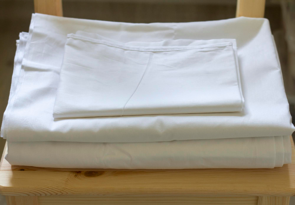 Folded white bed linen