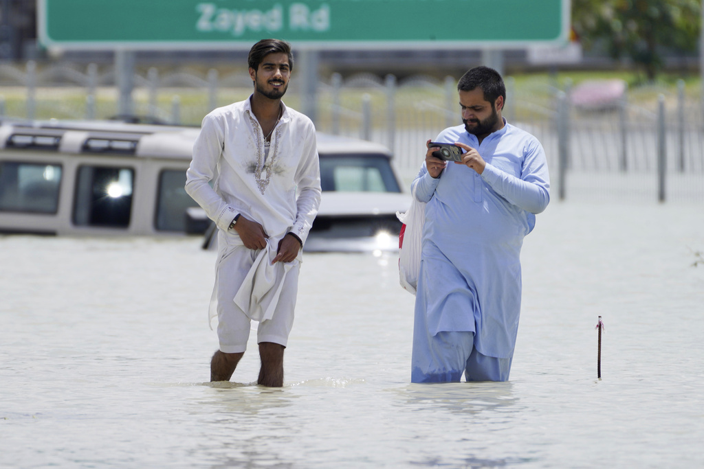 The desert nation of UAE records its most rain ever, flooding highways and Dubai's airport