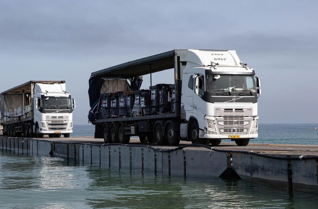 Trucks are rolling across a new US pier into Gaza. But challenges remain to getting enough aid in