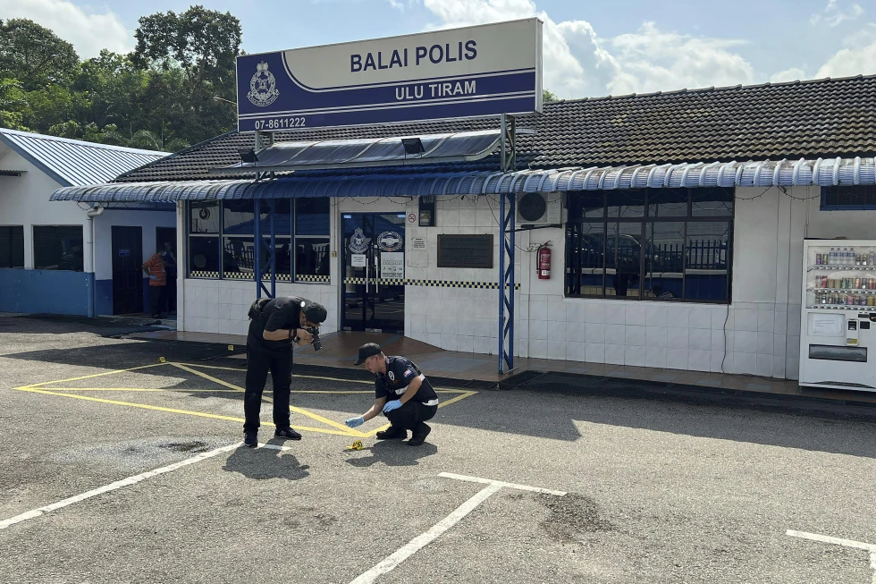 Malaysia minister says terror suspect who killed 2 police officers acted on his own