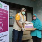 Qatar Charity distributes food packages for Indonesians affected by COVID-19