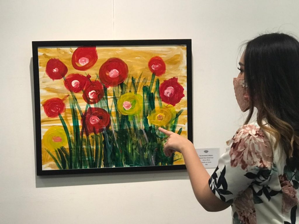 Autistic girl raises funds from painting exhibition for underprivileged families