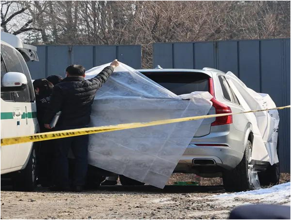 Police officers are examining a vehicle in central Seoul where Lee's body was discovered on Wednesday.