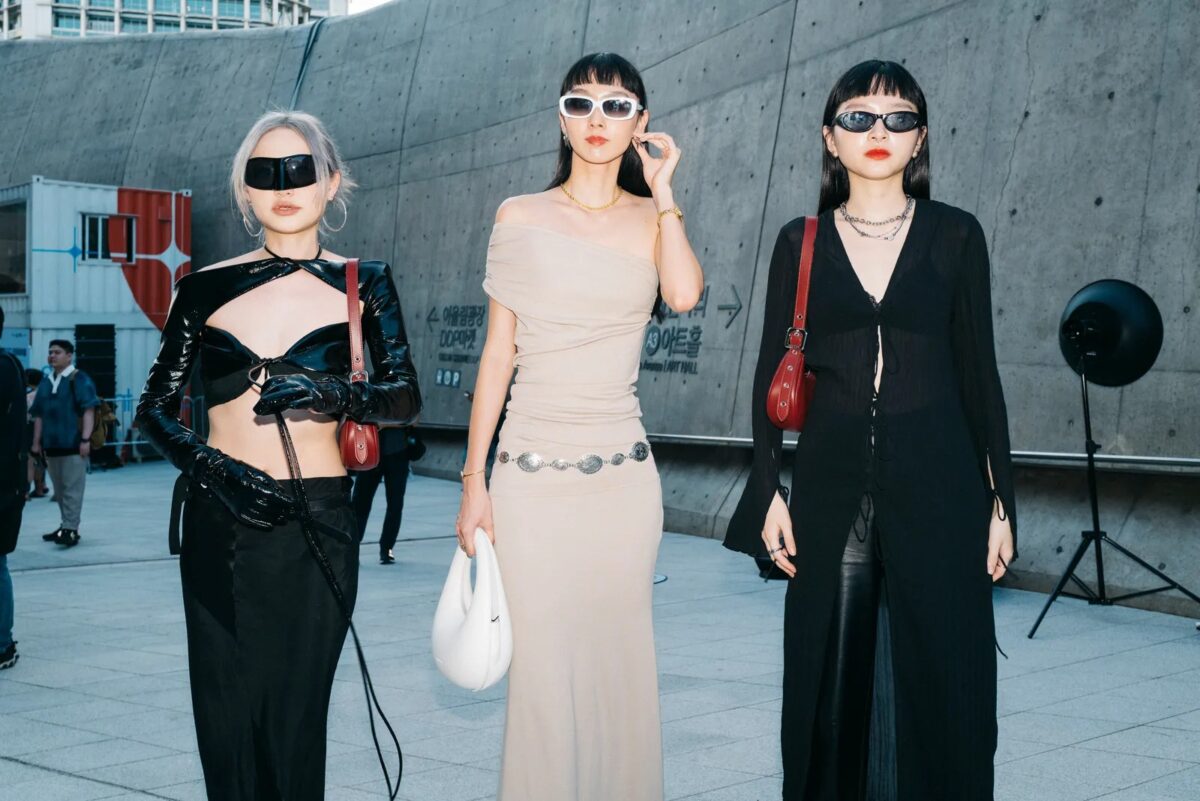 Three women dressed in stylistic street fits for Seoul Fashion Week