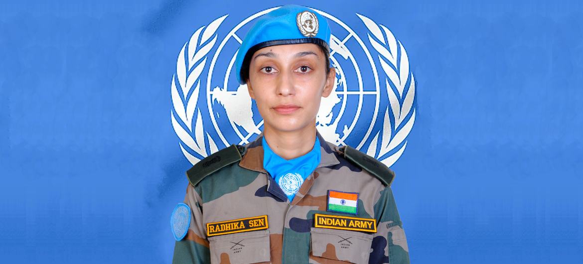 Major Radhika Sen in front of UN logo