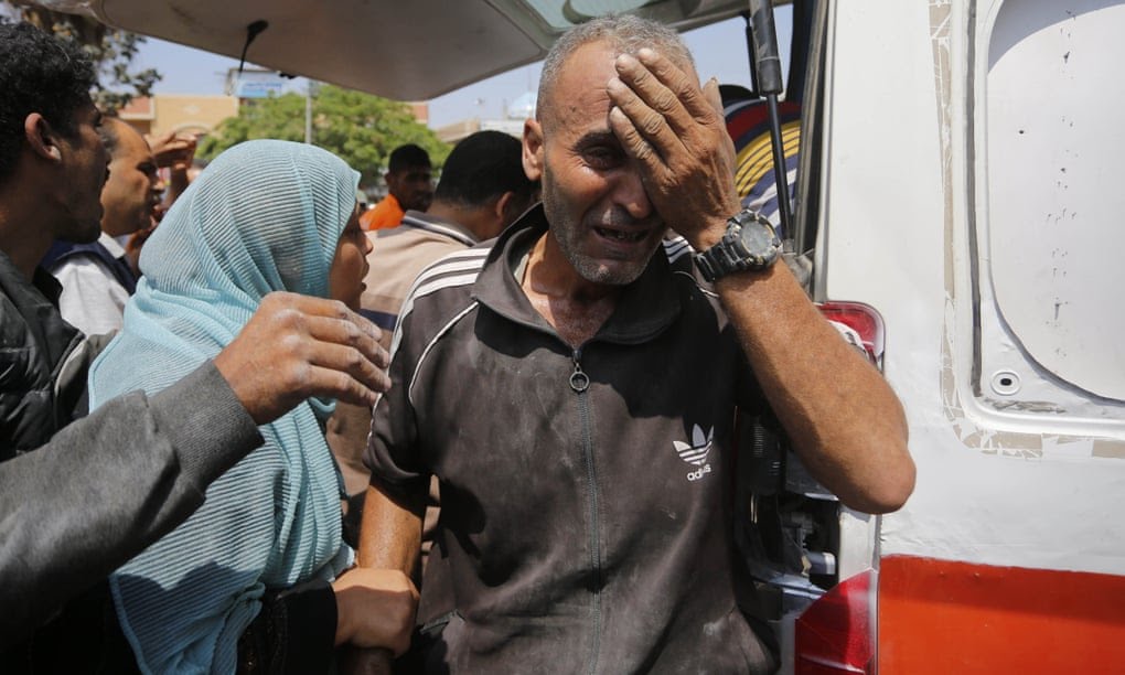 A man cries as injured Palestinians are transferred to al-Aqsa hospital after an Israeli attack on al-Magazi refugee camp in central Gaza on Wednesday. Hamas officials reported a death toll of at least 27 in an Israeli strike on a UN school in al-Nuseirat, after Israel announced a fresh operation in central Gaza. Photograph: Anadolu/Getty Images