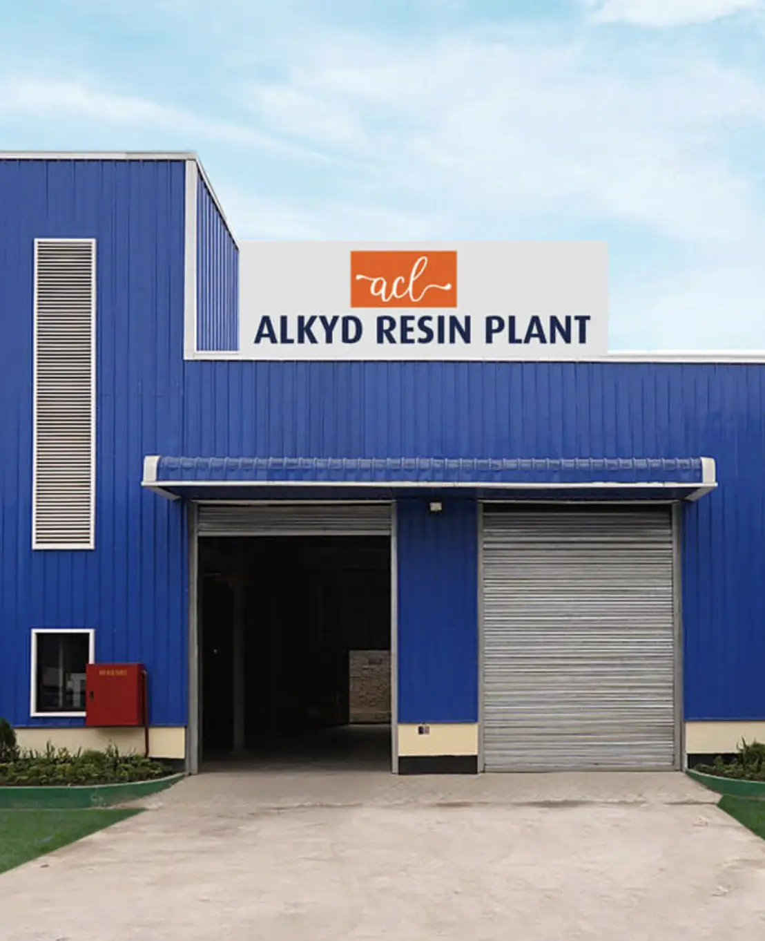 A wooden table with chairs in a room with a small chandlier
