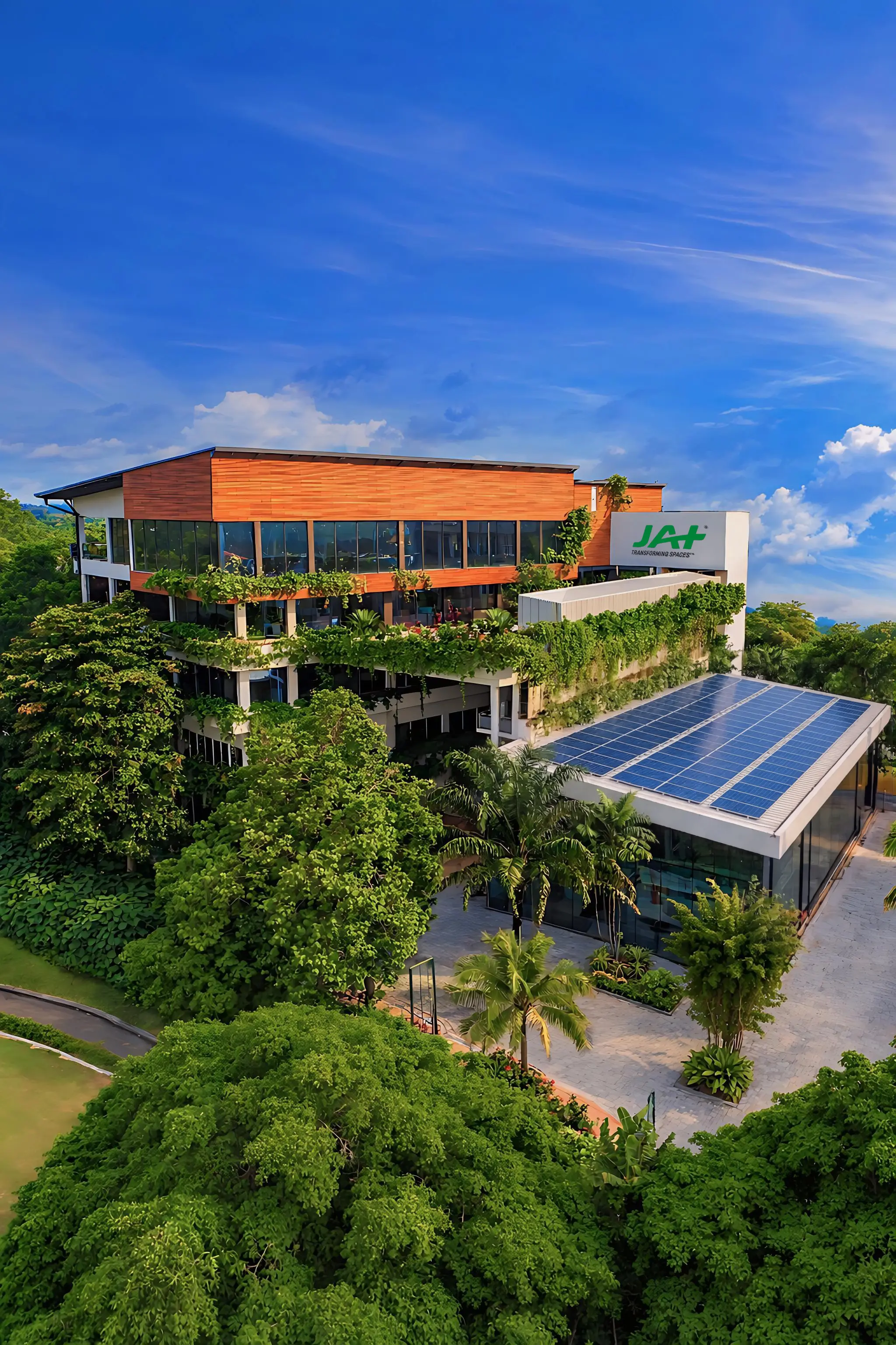 An apartment scheme with plants planted on the balconies with a view of sunset