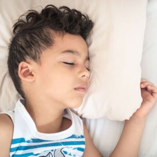 Boy asleep on a pillow