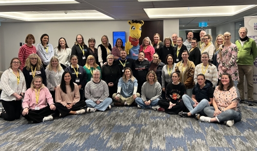 39 teachers and a giraffe mascot