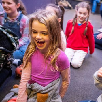 Girl laughing in Life Education mobile classroom