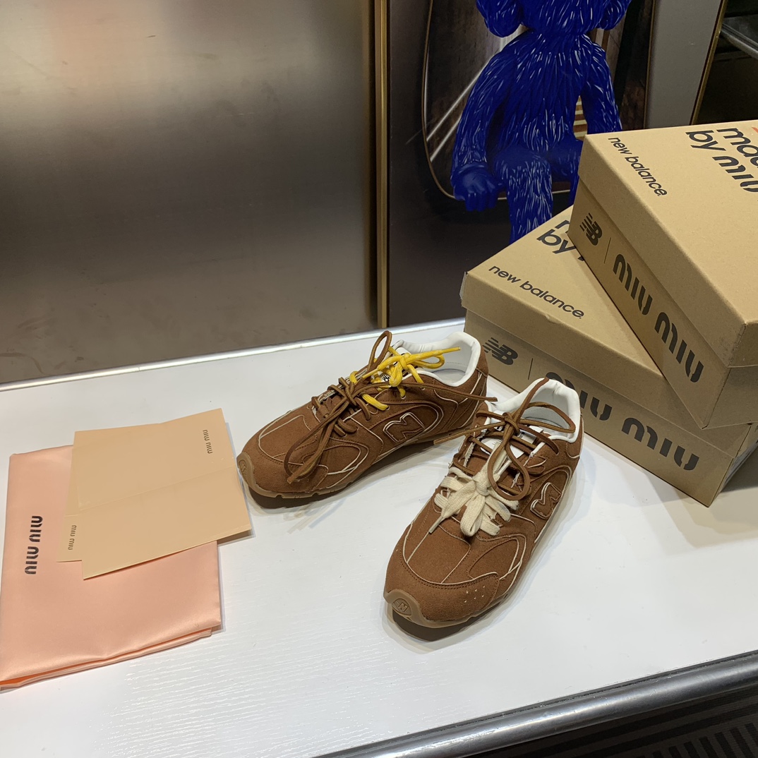 G180Z Miu Miu x New Balance $54 gallery