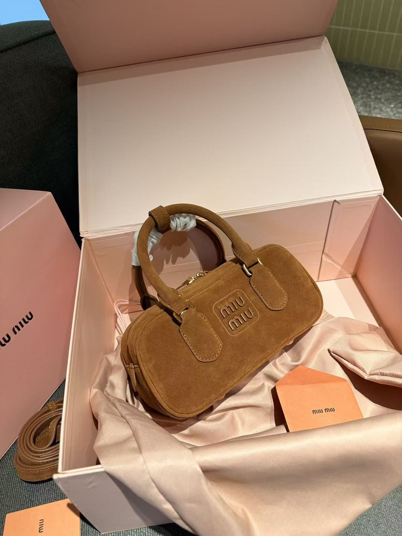 miumiu 56.54$ code 306-7808-R gallery