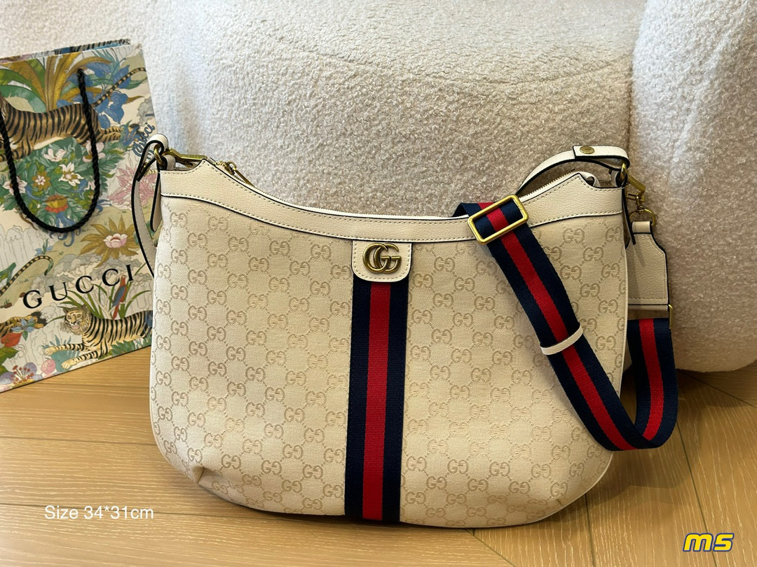 2914 $65 Gucci Half Month Bag gallery