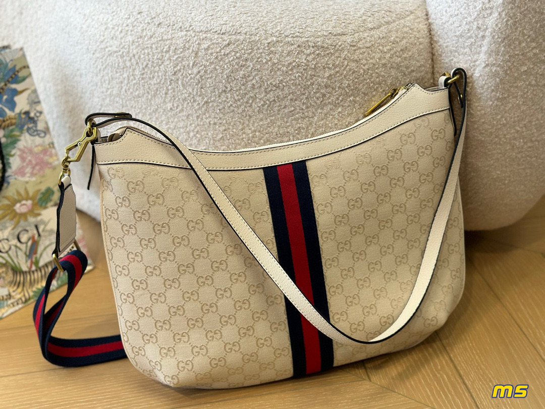 2914 $65 Gucci Half Month Bag gallery