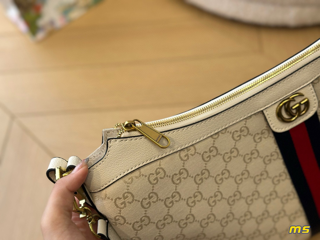 2914 $65 Gucci Half Month Bag gallery