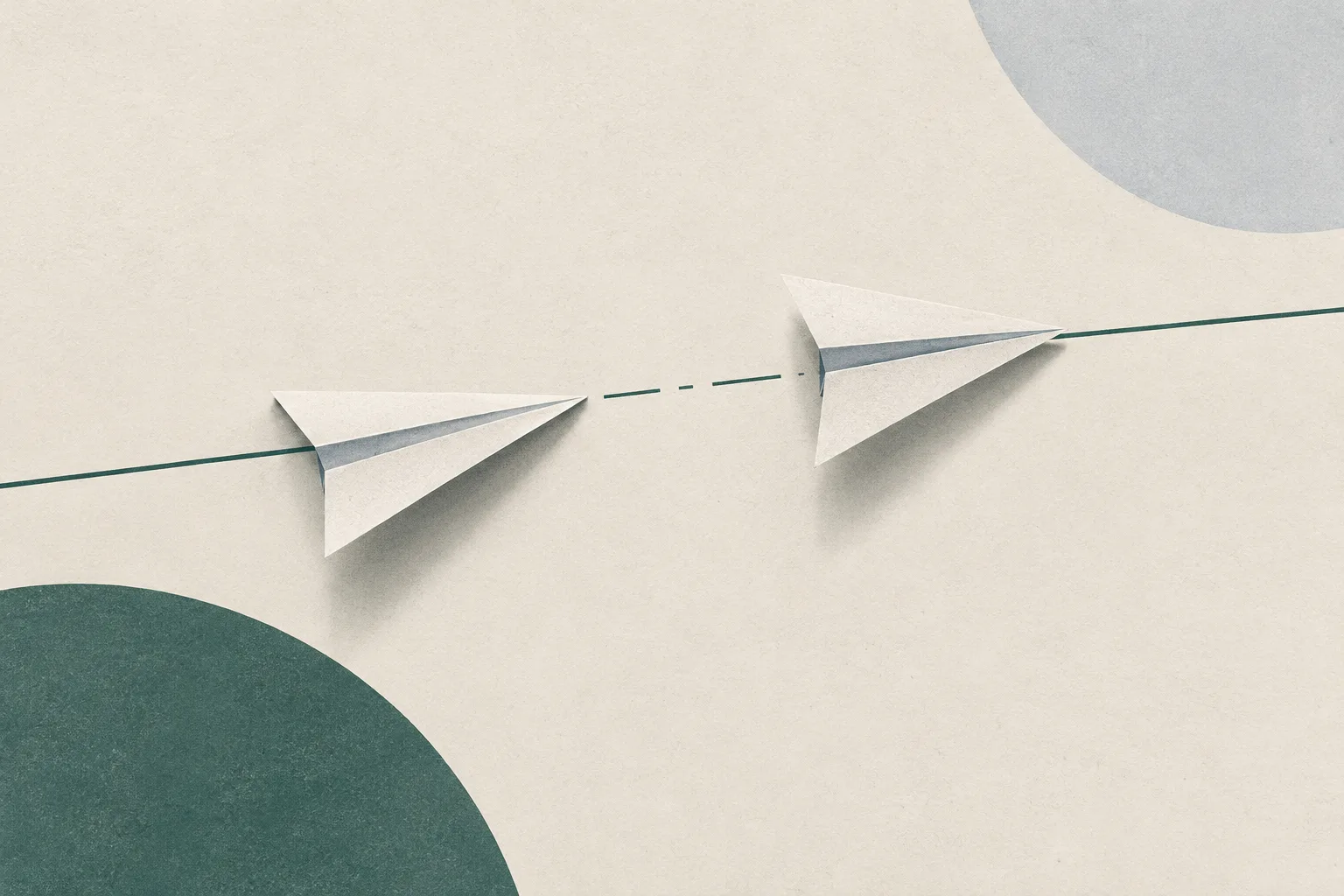 Two unmarked paper shapes sit slightly apart on a pale ground, crossed by a fine line that stops at the gap between them.