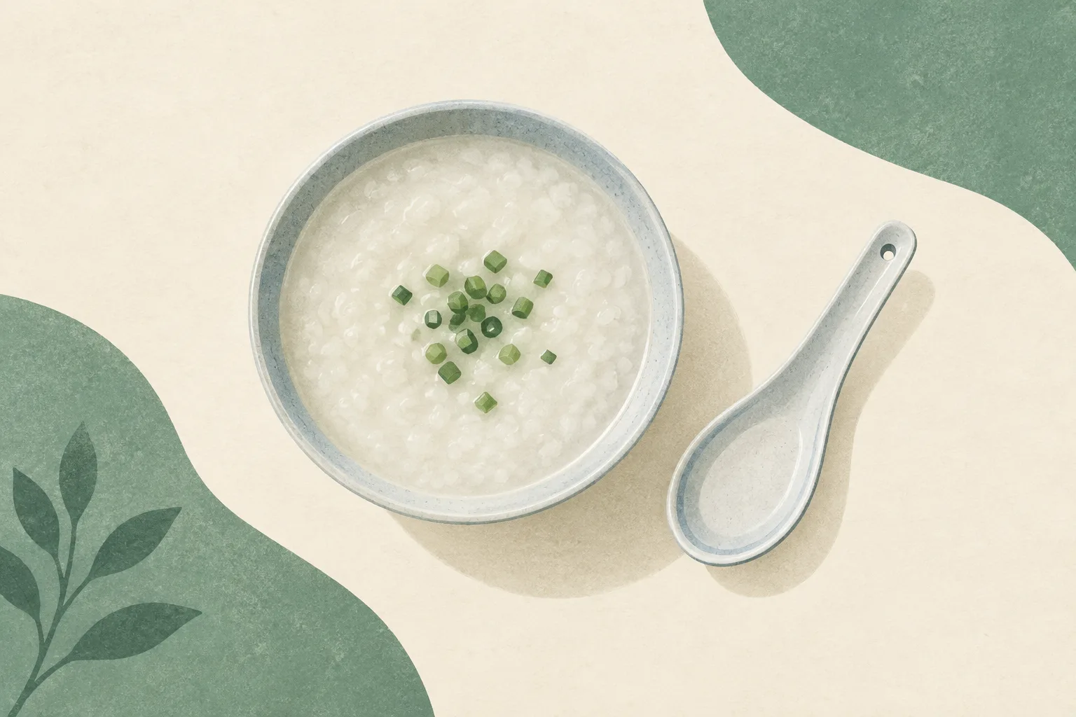A simple bowl of congee and a spoon on a cream surface, surrounded by muted green shapes and generous empty space.