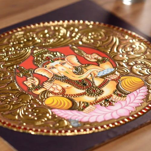 A finished round Lord Ganesha Tanjore painting with gold relief