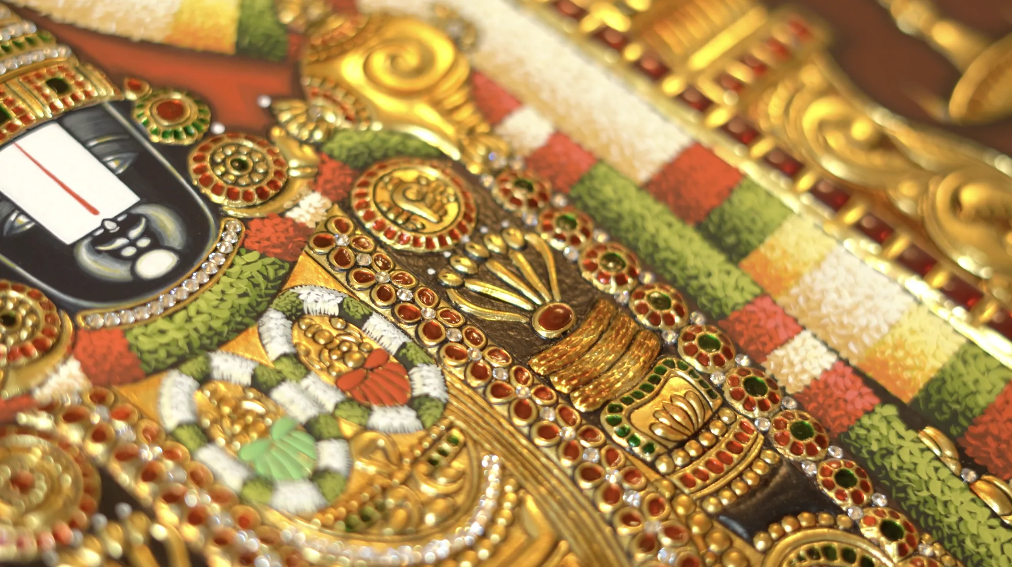 Gold-foil and jewellery detail on a Lord Balaji Tanjore painting