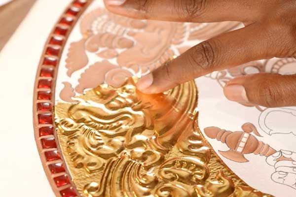 24 karat gold foil and kundan stones on a finished Tanjore painting