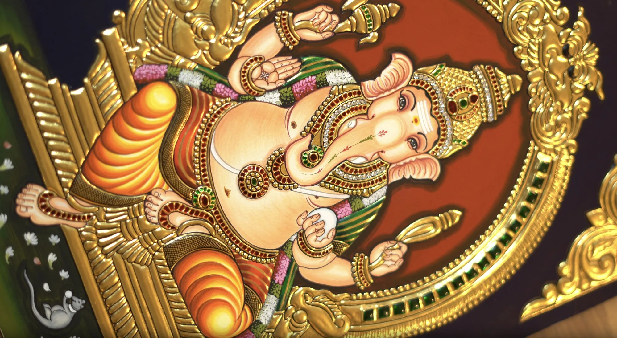Finished gold over raised gesso relief on a Ganesha Tanjore painting