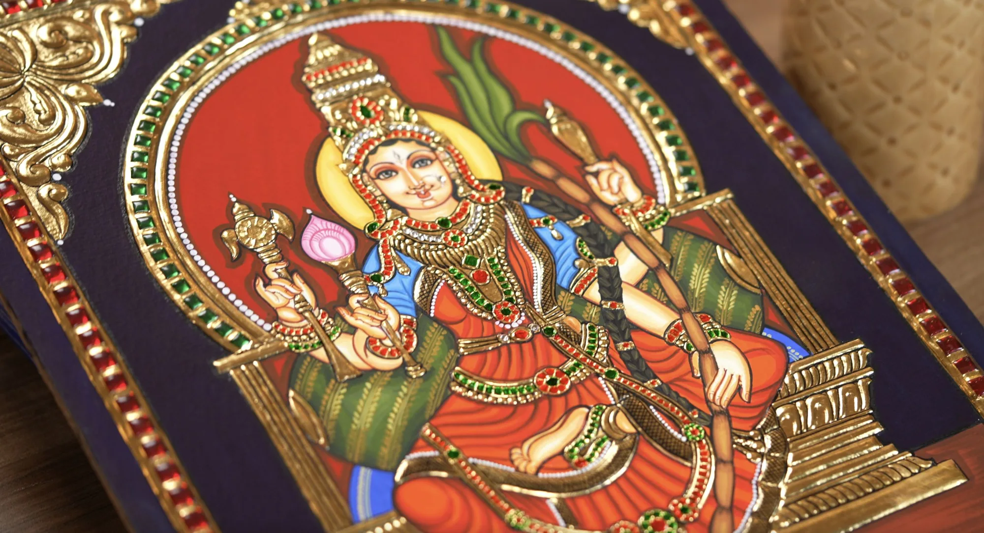 A brush at work on a Tanjore painting in progress