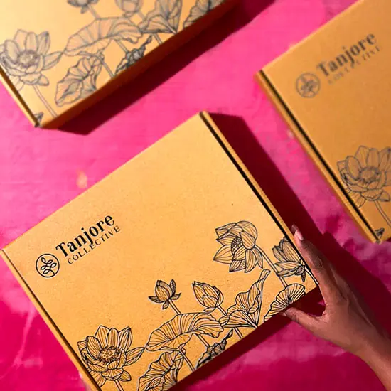 Tanjore Collective material kit boxes on pink silk