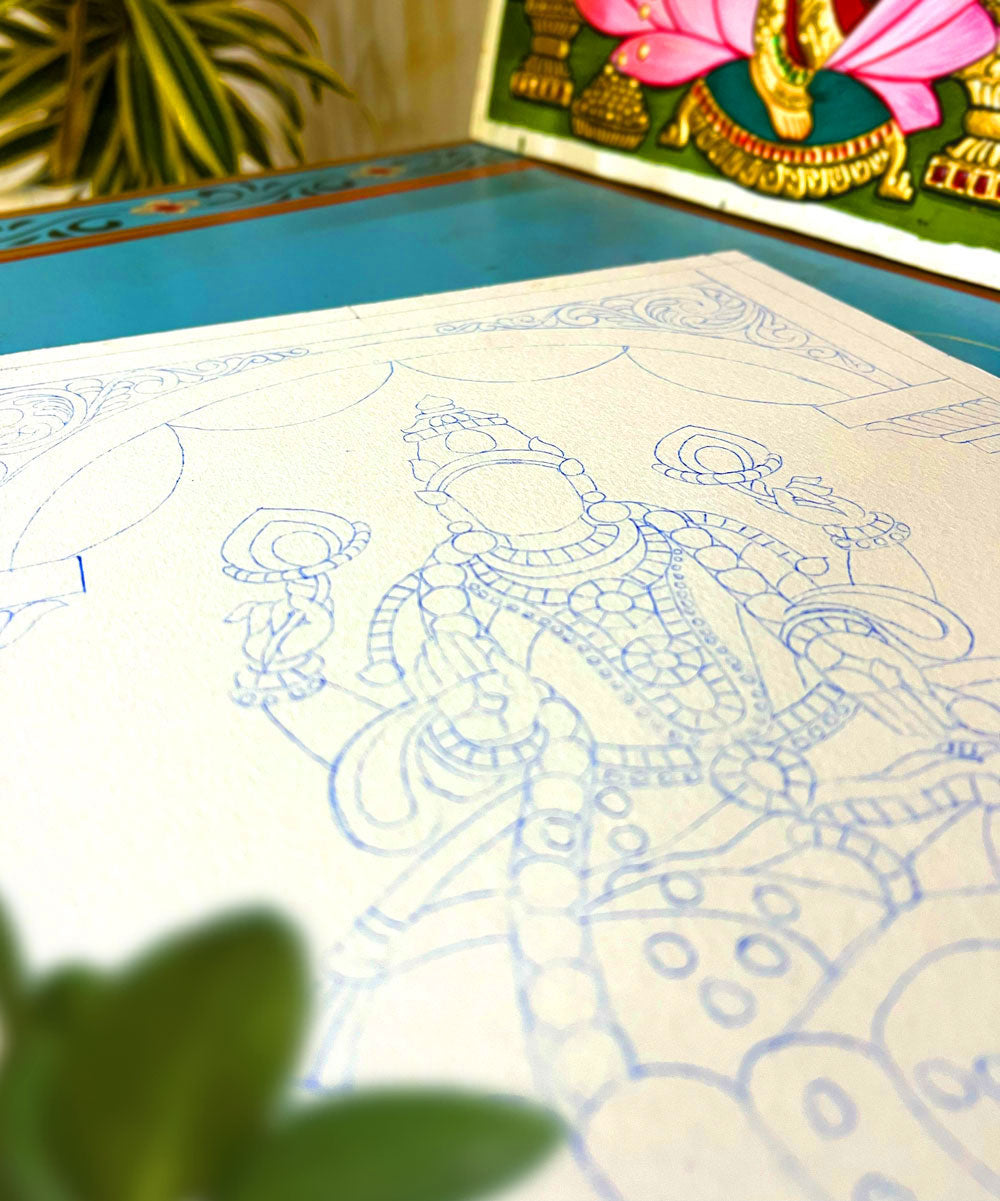A deity outline sketched on a prepared Tanjore painting canvas