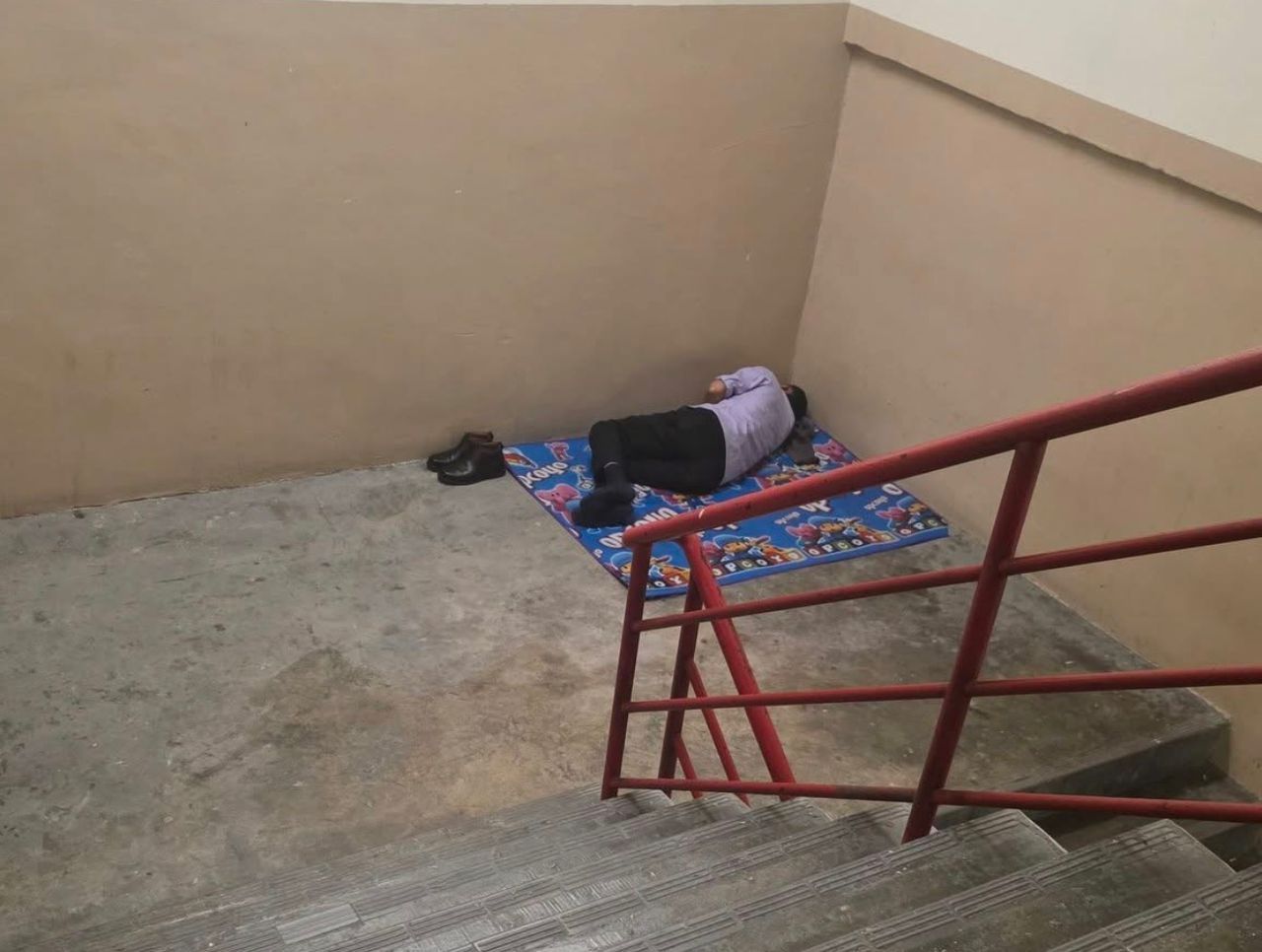 Malaysia’s rental pressures force migrant worker to sleep on stairwell