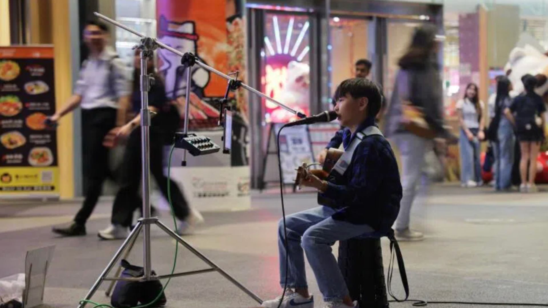 11-year-old boy earns $900 in six months by just singing on the streets in different languages