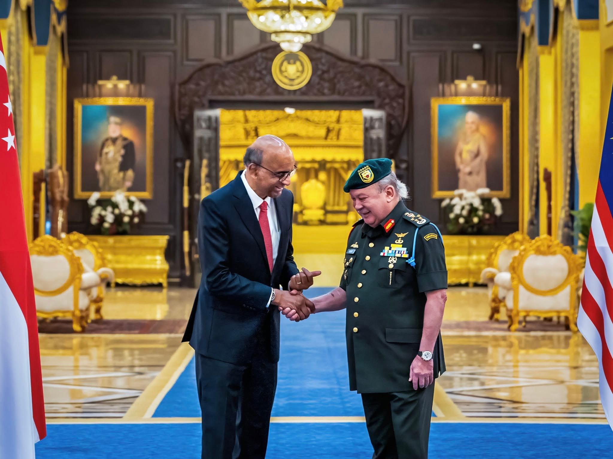 Singapore's President Tharman Shanmugaratnam (left) meets Malaysia's King Sultan Ibrahim Sultan Iskandar (right) during the first State Visit