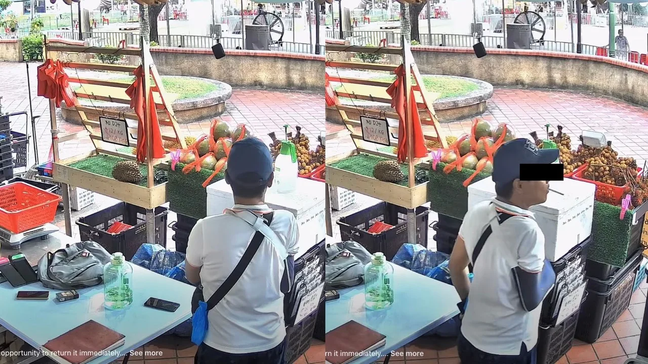 Man stares at CCTV, then casually steals phone into pocket at Yishun durian stall