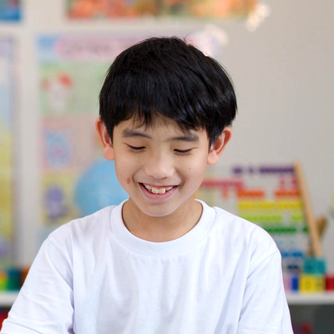 Happy student smiling in class