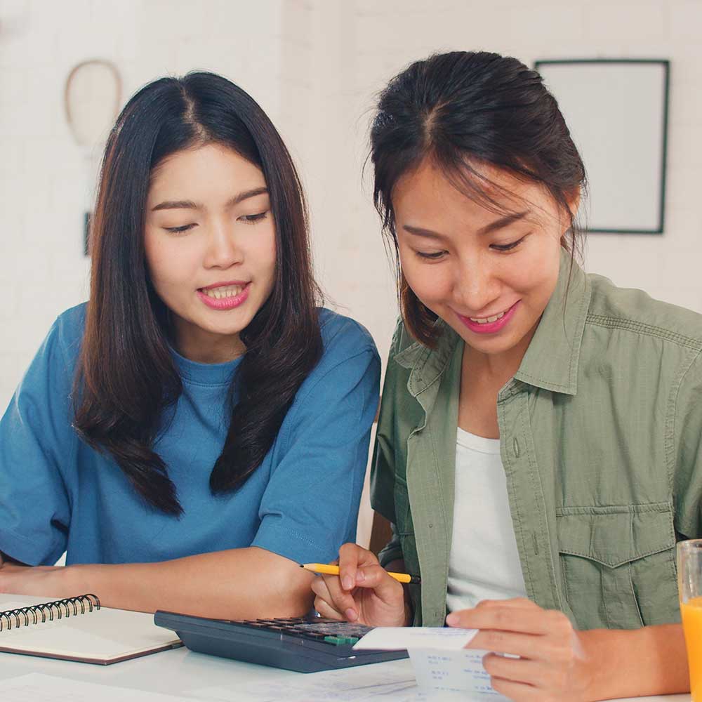 2 businesswomen doing accounting