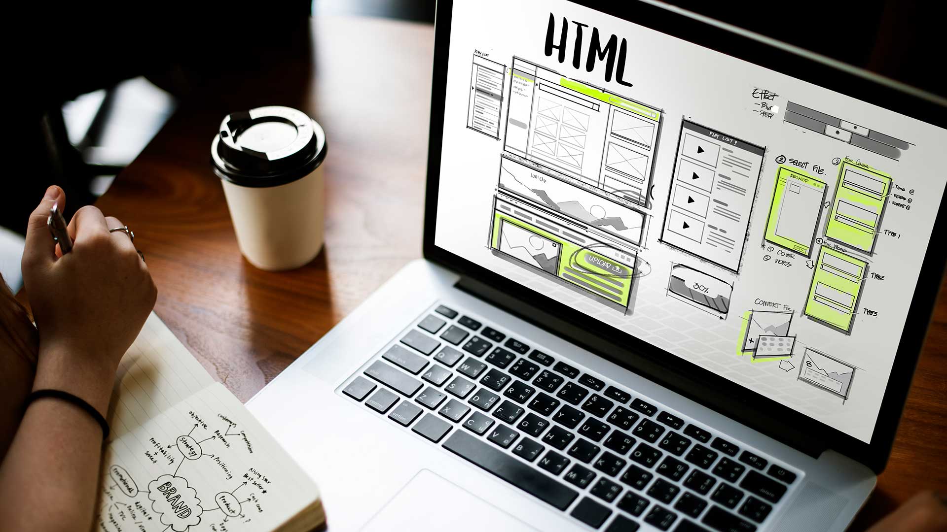 Laptop on desk planning and designing website