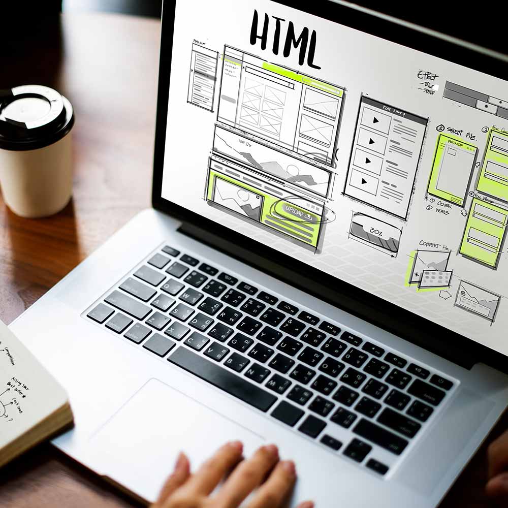 Laptop on desk planning and designing website
